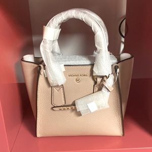 MICHAEL Michael Kors "Kris" 
Rolled top handles.